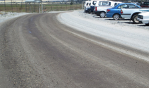 Dust-controlled unpaved road and parking area
