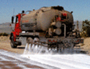 Dust suppression tanker spraying road