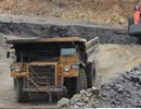 Loaded haul truck operating in an open-pit mine